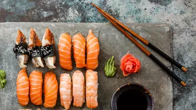 Premium Photo | Sushi roll black dragon on a white background