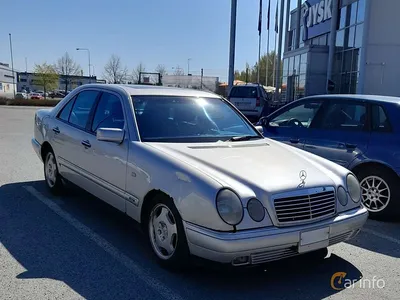 A mercedes benz w210 with lowered suspesion and a widebody kit on Craiyon