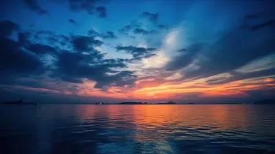 Морской фотопейзаж: катер «Авега» и яхты на горизонте в море после заката  (5720 на 3815 пикселей)