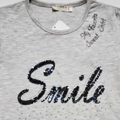 Лонгслив нежно-розового цвета, декорирован надписью ``Smile`` — SMIL, акция  действует до 31 декабря 2024 года | LeBoutique — Коллекция брендовых вещей  от SMIL — 6619079