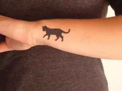 Значение татуировки кошка
