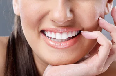 Что делать если потемнел зуб | Причины черноты на зубах